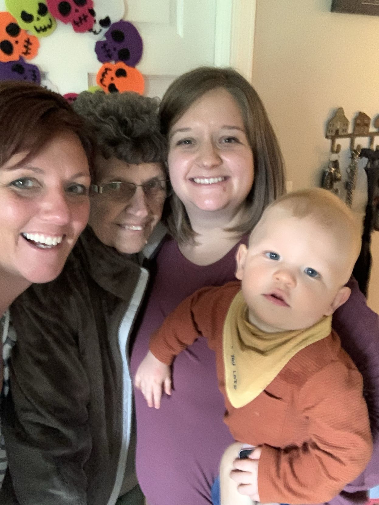 4 generations of smiling faces